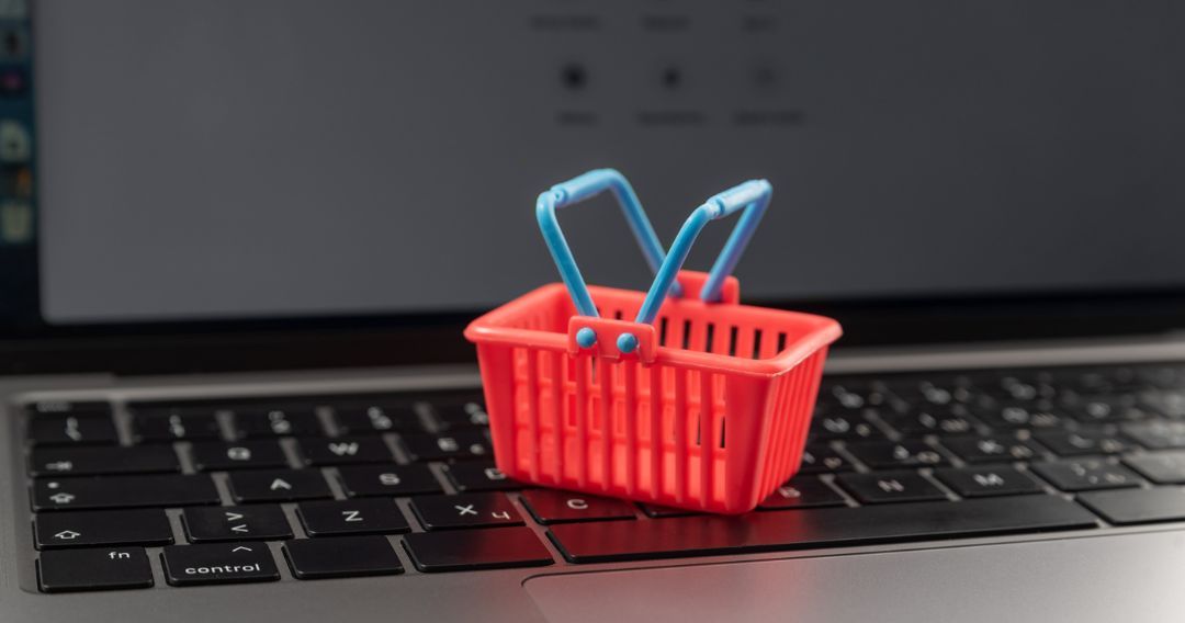 Small shopping cart on laptop keyboard