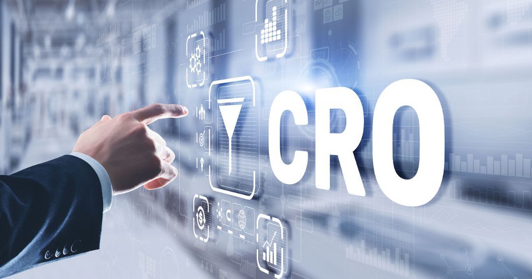 Businessman pressing on a virtual screen with CRO acronyms